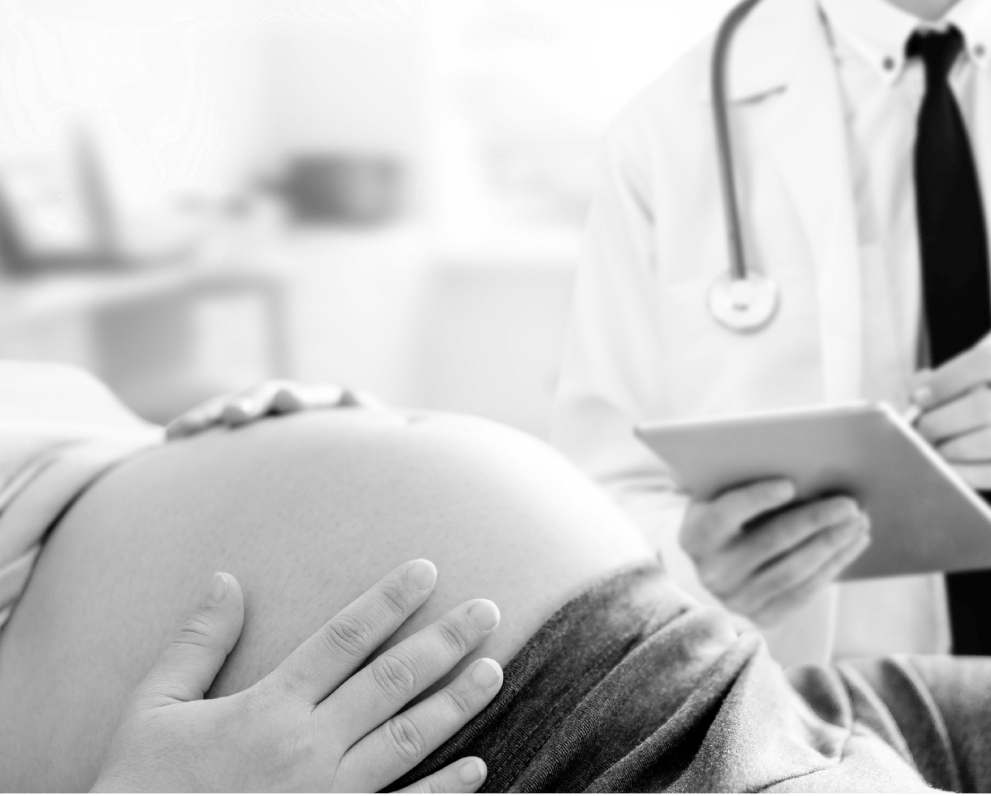 "Pregnant belly and doctor with tablet | OBHG"