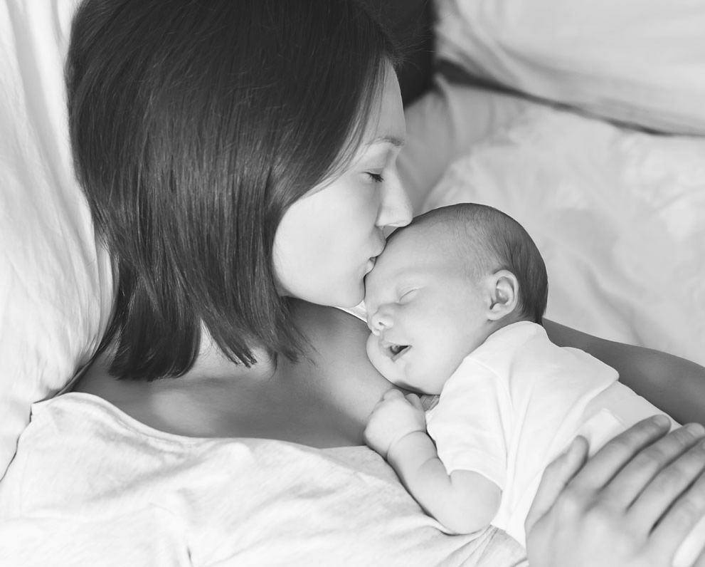 "Woman kissing newborn | OBHG"