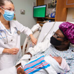 OBGYN with patient and newborn | OBHG