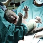 Newborn baby in delivery room | OBHG