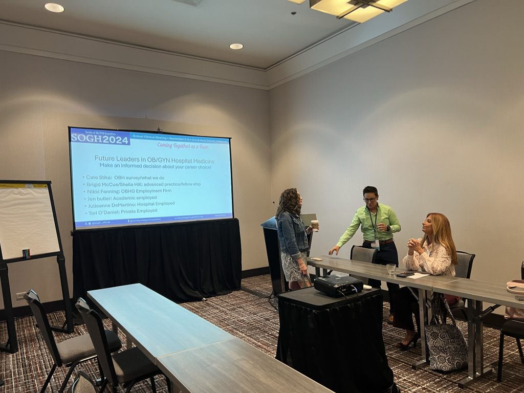 Dr. Nikki Fanning and two peers prepare for a presentation at the 2024 SOGH Annual Clinical Meeting